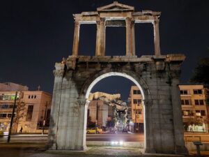 Athens: City Highlights Nighttime Walking Tour in Spanish - The neoclassical trio: National Library, University, and the Academy of Athens