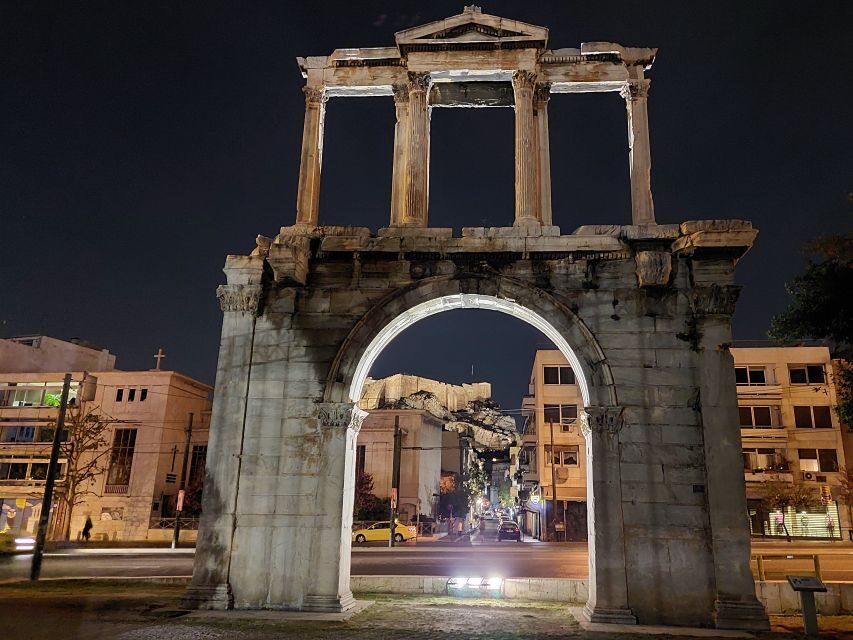 Athens: City Highlights Nighttime Walking Tour in Spanish - The neoclassical trio: National Library, University, and the Academy of Athens