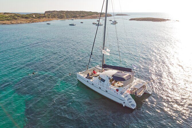 Athens Semi Private Sunset Catamaran Cruise with meal & drinks - Stop 1: Vouliagmeni Beach for Clear Water and an Easy First Swim